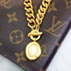 Givenchy Gold Plated Chunky Bracelet with Toggle Clasp and Logo Milk Pendant EUC
